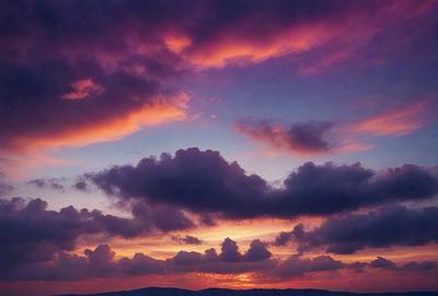 The primary subject of the image is a beautiful sunset with a purple sky. The setting is a mountainous landscape, with the sun setting behind the clouds. The visual style is a photo, capturing the stunning colors and atmosphere of the sunset. The dominant colors are purple and orange, creating a serene and picturesque scene.