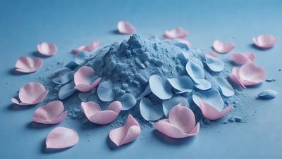 The primary subject of the image is a pile of blue flowers, which are scattered across a blue surface. The setting appears to be a studio or a controlled environment, as the flowers are arranged in a visually appealing manner. The visual style of the image is a combination of photo and digital art, creating a unique and artistic representation of the flowers. The dominant colors in the image are blue and pink, giving the scene a calm and serene atmosphere.