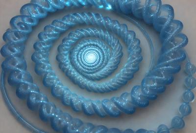 The primary subject of the image is a blue spiral or swirl, which appears to be a piece of art or a decorative item. The setting is a white surface, which provides a clean and uncluttered backdrop for the spiral. The visual style of the image is a combination of artistic and digital elements, creating a unique and eye-catching design. The dominant colors in the image are blue and white, giving the spiral a calming and serene atmosphere.