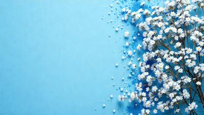The primary subject of the image is a close-up of a flower, possibly a daisy, with a blue background. The visual style appears to be a digital art or illustration, as the flower is depicted in a detailed and artistic manner. The colors in the image are predominantly blue, creating a calm and serene atmosphere.