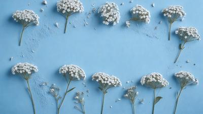 The primary subject of the image is a group of white flowers, which are the main objects in the scene. The flowers are arranged in a pattern on a blue surface, which serves as the background. The visual style of the image is a combination of photo and digital art, creating a unique and artistic representation of the flowers. The dominant colors in the image are white and blue, giving the scene a clean and serene atmosphere.