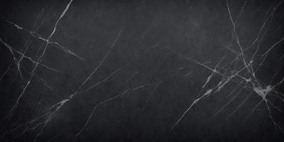 The primary subject of the image is a black marble countertop. The setting is a dark room, and the visual style is a close-up of the marble countertop. The countertop appears to be a dark grey color, giving it a sophisticated and elegant appearance.