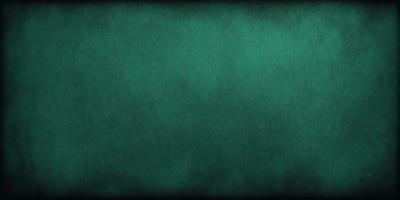 The primary subject of the image is a green background, which appears to be a wall or a piece of fabric. The setting is a dark room, and the visual style is a close-up of the green background. The colors and mood of the image are predominantly green, creating a calm and serene atmosphere.
