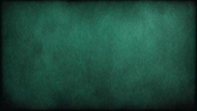 The primary subject of the image is a green background, which appears to be a wall or a piece of fabric. The setting is a dark room, and the visual style is a close-up of the green background. The colors and mood of the image are predominantly dark and moody, with the green background being the main focus.