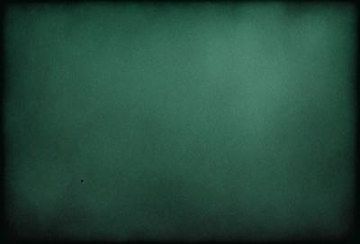 The primary subject of the image is a large, dark green wall. The setting is a room with a green background, and the visual style appears to be a photo. The dominant colors are green, and the overall atmosphere is calm and serene.