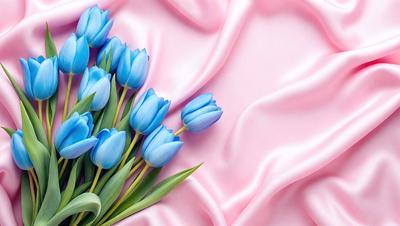 The primary subject of the image is a bouquet of blue tulips. The setting is a pink background, which adds a contrasting color to the scene. The visual style is a close-up of the flowers, showcasing their beauty. The colors and mood of the image are predominantly pink and blue, creating a serene and calming atmosphere.
