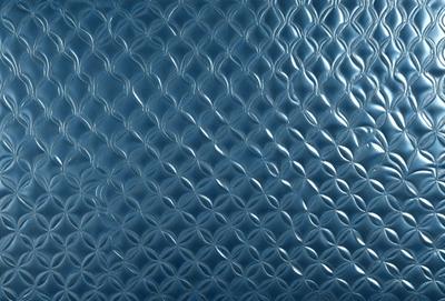 The primary subject of the image is a close-up of a blue, textured surface with a pattern of white circles. The setting appears to be a room with a blue wall, and the visual style is a combination of a photo and digital art. The dominant colors are blue and white, creating a calm and soothing atmosphere.