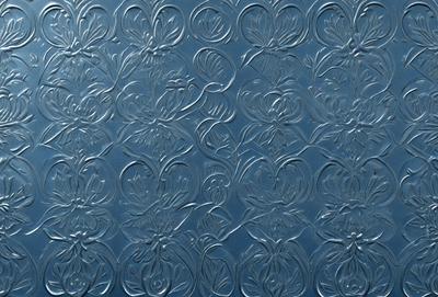 The primary subject of the image is a blue wall with a pattern of flowers. The setting is indoors, and the visual style appears to be a combination of photo and digital art. The dominant colors are blue and white, creating a calm and serene atmosphere.