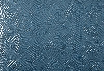 The primary subject of the image is a blue wall with a pattern of interlocking shapes. The setting is indoors, and the visual style appears to be a combination of digital art and illustration. The dominant colors are blue and gray, creating a calm and soothing atmosphere.