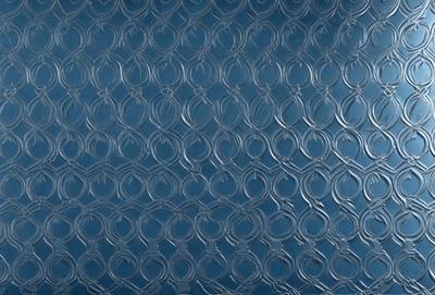 The primary subject of the image is a blue wall with a pattern of circles. The setting is a room with a blue background. The visual style is a combination of a photo and digital art, creating a unique and intricate design. The dominant colors are blue and silver, giving the wall a modern and sophisticated appearance.