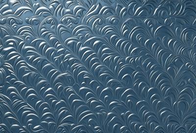 The primary subject of the image is a blue and silver metal wall with a pattern of waves. The setting is a room with a blue background, and the visual style is a combination of photo and digital art. The dominant colors are blue and silver, creating a calm and soothing atmosphere.