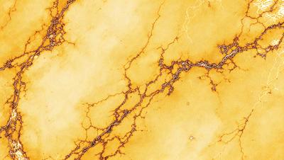 The primary subject of the image is a yellow marble wall with a cracked and bumpy texture. The setting is a room with a yellow marble wall, and the visual style is a close-up of the wall. The colors and mood of the image are warm and earthy, with the yellow marble wall being the dominant feature.