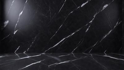 The primary subject of the image is a marble wall with a black background. The setting is a room with a black marble floor. The visual style is a photo of a marble wall, showcasing the natural texture and patterns of the material. The colors and mood of the image are predominantly black and white, giving it a sleek and modern appearance.