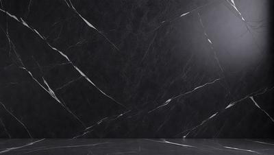 The primary subject of the image is a black marble wall. The setting is a room with a black marble wall as the main focus. The visual style is a photo, capturing the black marble wall in detail. The colors and mood of the image are predominantly black, giving it a sleek and modern appearance.