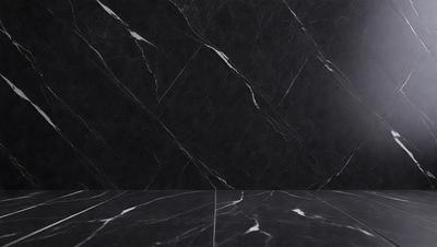 The primary subject of the image is a black marble wall. The setting is a room with a black marble countertop. The visual style is a photo of the marble wall. The colors and mood are dark and moody, with the black marble creating a dramatic and sophisticated atmosphere.