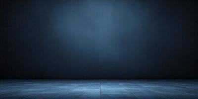 The primary subject of the image is a blue wall with a blue floor. The setting is a dark room with a blue background. The visual style is a photo, and the colors and mood are predominantly blue, creating a calm and serene atmosphere.