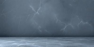 The primary subject of the image is a wall with a lightning bolt pattern on it. The setting is a room with a gray wall, and the visual style is a photo. The dominant colors are gray and white, creating a calm and minimalist atmosphere.