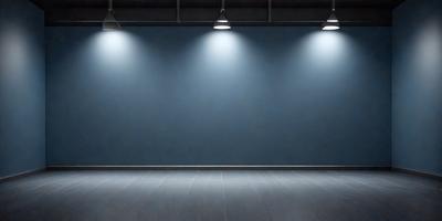 The primary subject of the image is a large, empty room with a blue wall. The setting is a large, open space with a blue wall and a wooden floor. The visual style is a photo, and the colors and mood are predominantly blue, creating a calm and serene atmosphere.