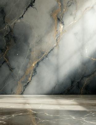 The primary subject of the image is a marble wall with a light shining on it. The setting is a room with a marble floor. The visual style is a photo, and the colors and mood are predominantly dark, with the light source creating a contrasting effect.