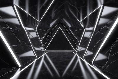 The primary subject of the image is a black and white photo of a marble-like surface with a pattern of triangles. The setting is a dark room, and the visual style is a black and white photo. The dominant colors are black and white, and the overall atmosphere is mysterious and intriguing.