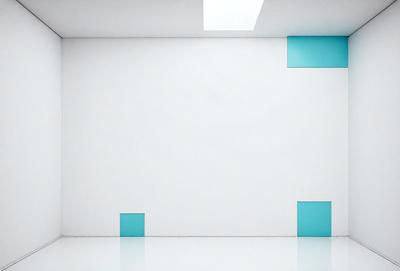 The primary subject of the image is a white wall with blue squares on it. The setting is a white room, and the visual style is a photo. The dominant colors are white and blue, creating a clean and modern atmosphere.