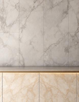 The primary subject of the image is a marble countertop with a white marble wall behind it. The setting is a kitchen or bathroom, as the countertop is a part of a counter. The visual style is a photo, capturing the natural beauty of the marble surface. The colors and mood of the image are predominantly white and neutral, giving it a clean and elegant appearance.