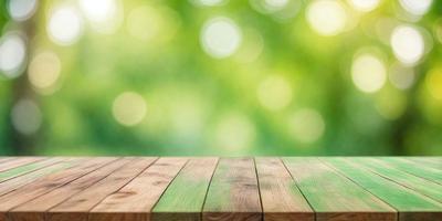 The primary subject of the image is a wooden table with a green surface. The table is placed in a setting with a green background, which includes a forest-like environment. The visual style of the image is a photo, capturing the natural surroundings and the wooden table. The colors and mood of the image are predominantly green, creating a serene and peaceful atmosphere.