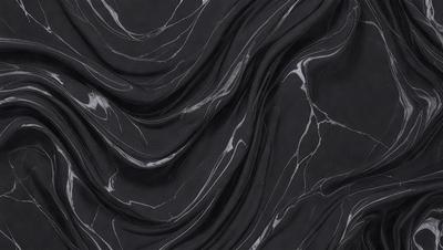 The primary subject of the image is a black marble countertop. The setting is a kitchen, with the countertop being the main focus of the scene. The visual style is a close-up of the marble countertop, showcasing its texture and pattern. The colors and mood of the image are predominantly dark, with the black marble creating a dramatic and elegant atmosphere.
