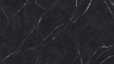 The primary subject of the image is a black marble countertop. The setting is a kitchen, with the countertop being the main focus of the scene. The visual style is a close-up of the marble countertop, showcasing its texture and pattern. The colors and mood of the image are predominantly dark, with the black marble countertop being the main source of contrast.