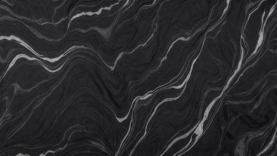 The primary subject of the image is a black and white marble pattern. The setting is a black background, which contrasts with the marble pattern. The visual style is a close-up of the marble pattern, showcasing its intricate details. The colors and mood of the image are predominantly black and white, giving it a classic and elegant appearance.