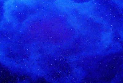 The primary subject of the image is a blue sky filled with stars. The setting is a night sky, and the visual style appears to be a digital art or illustration. The dominant colors are blue and white, creating a serene and peaceful atmosphere.
