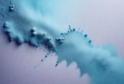 The primary subject of the image is a blue substance, possibly a paint or a dye, that is spreading and dripping onto a surface. The setting appears to be a white wall, which contrasts with the blue substance. The visual style of the image is a close-up of the blue substance, showcasing its texture and movement. The colors and mood of the image are predominantly blue, creating a calm and serene atmosphere.