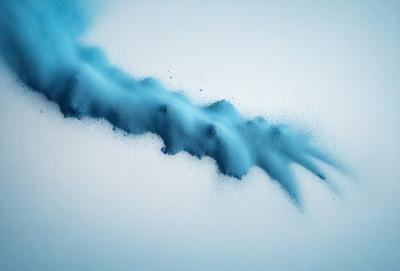 The primary subject of the image is a blue, swirling, and flowing substance, which appears to be a mix of water and powdered substances. The setting is a white background, which contrasts with the blue substance. The visual style is a combination of a photo and digital art, creating a unique and captivating scene. The colors and mood of the image are predominantly blue, with a sense of motion and flow, giving the impression of a dynamic and fluid substance.