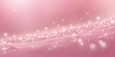 The primary subject of the image is a close-up of a pink surface with a pattern of tiny droplets of water. The setting is a pink background, and the visual style appears to be a photo. The colors and mood of the image are predominantly pink, creating a warm and inviting atmosphere.