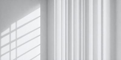 The primary subject of the image is a white curtain. The setting is a white wall, and the visual style is a photo. The curtain is hanging on the wall, and the overall atmosphere is clean and minimalistic.