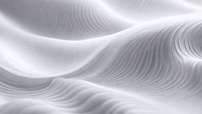 The image features a white, textured surface that resembles a wave or a ripple. The primary subject is the white surface, which is the main focus of the image. The setting is a white background, and the visual style is a close-up of the white surface. The colors and mood of the image are predominantly white, creating a clean and minimalist atmosphere.