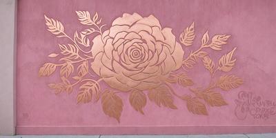 The primary subject of the image is a beautifully crafted metal rose. The rose is the focal point of the scene, and it is displayed against a pink background. The visual style of the image is a combination of digital art and illustration, creating a unique and eye-catching design. The colors in the image are predominantly pink, which adds a sense of warmth and elegance to the overall atmosphere.