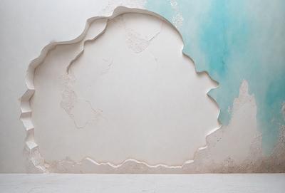 The primary subject of the image is a white wall with a large, intricate design on it. The design appears to be a combination of a mosaic and a painting, creating a visually striking and unique pattern. The setting is a room with a white floor, which complements the white wall and adds to the overall clean and minimalist aesthetic of the space. The visual style of the image is a blend of artistic elements, such as the mosaic and painting, creating a unique and eye-catching