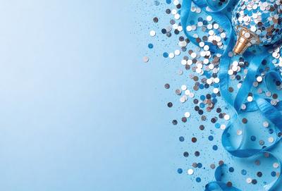 The primary subject of the image is a close-up of a blue background with a pattern of silver confetti. The setting is a blue background, and the visual style appears to be a digital art or illustration. The dominant colors are blue and silver, creating a calm and serene atmosphere.