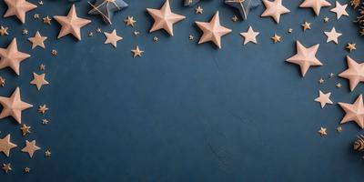 The primary subject of the image is a blue wall with stars drawn on it. The setting is a room with a blue background. The visual style is a combination of a photo and digital art, creating a unique and artistic representation of the stars on the wall. The colors and mood of the image are predominantly blue, giving it a calm and serene atmosphere.