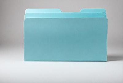 The primary subject of the image is a blue folder. The setting is a white background, and the visual style is a photo. The dominant colors are blue and white, creating a calm and professional atmosphere.