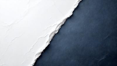 The primary subject of the image is a white wall with a blue background. The wall appears to be peeling, revealing a white substance beneath it. The setting is indoors, and the visual style is a close-up of the wall. The colors and mood of the image are predominantly blue and white, creating a calm and serene atmosphere.