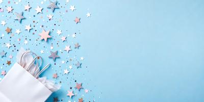 The primary subject of the image is a blue background with a pattern of stars. The setting is a clear blue sky, and the visual style is a digital art or illustration. The dominant colors are blue and white, creating a calm and serene atmosphere.