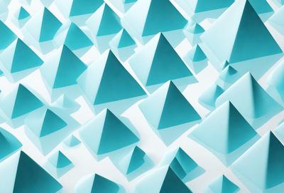 The primary subject of the image is a large number of blue triangles, which are arranged in a pattern. The setting is a white background, and the visual style appears to be a digital art or illustration. The dominant colors are blue and white, creating a calm and soothing atmosphere.