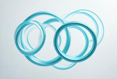 The primary subject of the image is a close-up of three blue rings, which are the main objects in the scene. The setting is a white background, which provides a clean and minimalist appearance. The visual style is a digital art or illustration, as the rings are depicted in a detailed and artistic manner. The dominant colors are blue, which creates a calm and soothing atmosphere.