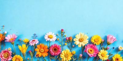 The primary subject of the image is a bouquet of colorful flowers, including pink, yellow, and orange, arranged in a visually appealing manner. The flowers are placed against a blue background, which adds a sense of depth and contrast to the scene. The visual style of the image is a combination of photo and digital art, creating a vibrant and lively atmosphere. The dominant colors in the image are pink, yellow, and orange, which evoke feelings of warmth, happiness, and energy.