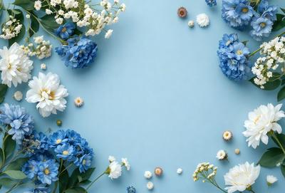 The primary subject of the image is a bouquet of white and blue flowers. The flowers are arranged in a circular pattern on a blue surface, which could be a table or a wall. The visual style of the image is a close-up of the flowers, showcasing their details and beauty. The colors and mood of the image are predominantly blue, creating a calm and serene atmosphere.