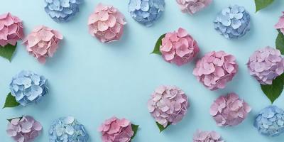 The primary subject of the image is a group of pink and blue flowers. The flowers are arranged in a visually appealing manner, creating a sense of harmony and beauty. The setting is a blue surface, which serves as a striking backdrop for the flowers. The visual style of the image is a combination of photo and digital art, resulting in a vibrant and realistic representation of the flowers. The colors and mood of the image are predominantly pink and blue, evoking a sense of calmness and tran