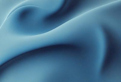 The primary subject of the image is a blue, flowing, and swirling fabric. The setting is a dark background, which contrasts with the blue fabric. The visual style is a close-up of the fabric, showcasing its texture and pattern. The colors and mood of the image are predominantly blue, creating a calm and serene atmosphere.