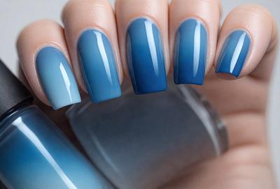 The primary subject of the image is a person's hand holding a bottle of nail polish. The hand is positioned in the foreground, with the bottle of nail polish in the middle of the scene. The background features a blue and white color scheme, creating a visually appealing and calming atmosphere. The image is a close-up of the hand and the bottle, emphasizing the focus on the nail polish and the person's hand.